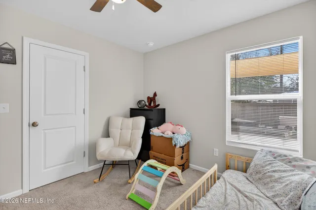 a living room with furniture and a window