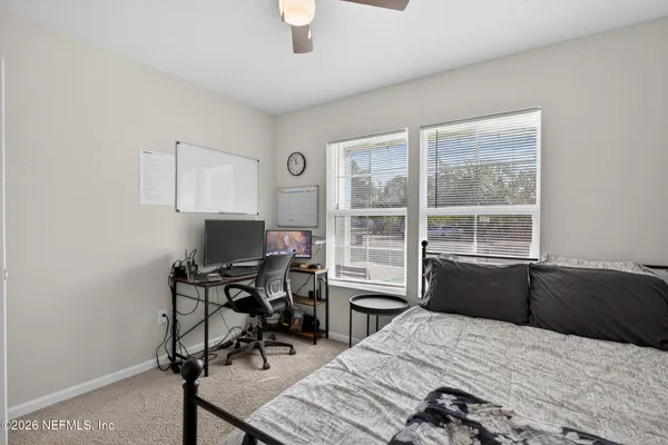 a bedroom with a bed and a table in it