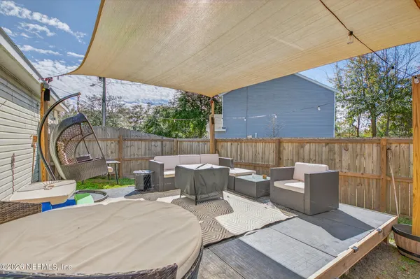 swimming pool view with a seating space