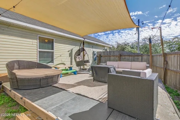a view of a patio with couches table and chairs