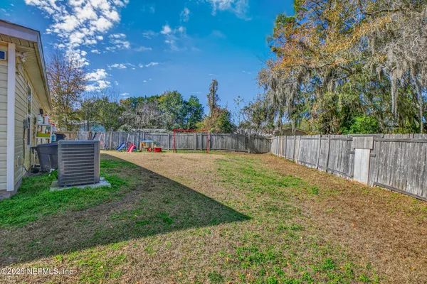 a view of a backyard with trees