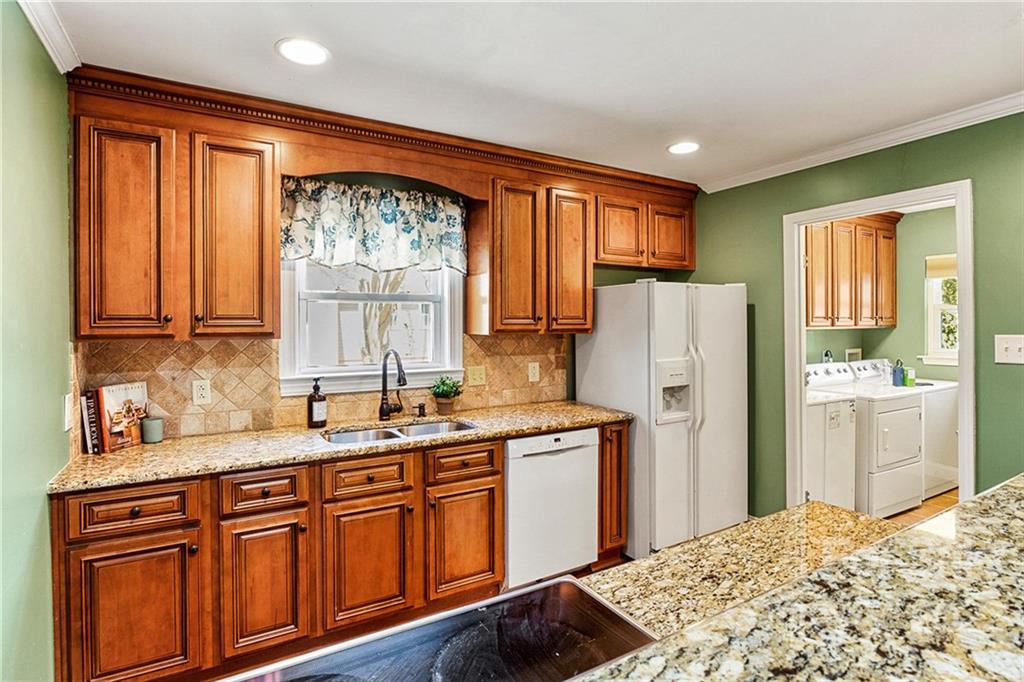 422 Fieldstone Road Mooresville, NC 28115 - Photo 11 of 36 a kitchen with stainless steel appliances granite countertop a refrigerator sink and cabinets