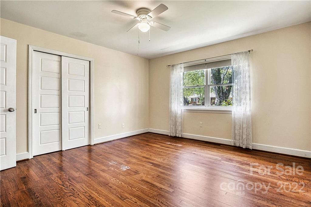 422 Fieldstone Road Mooresville, NC 28115 - Photo 16 of 36 a view of an empty room with wooden floor and a window