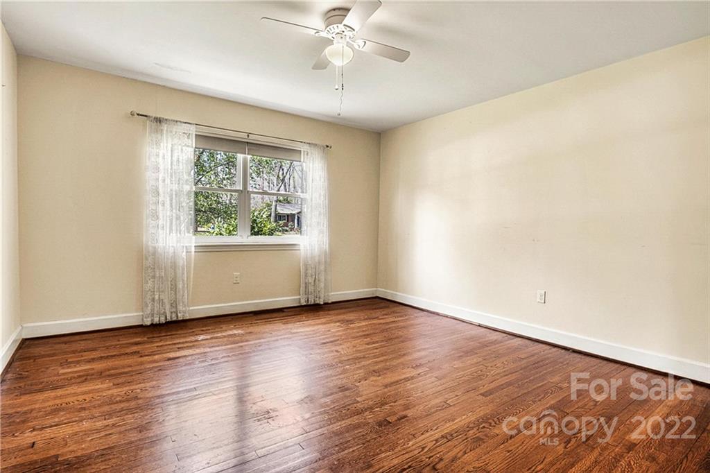 422 Fieldstone Road Mooresville, NC 28115 - Photo 17 of 36 a view of an empty room with wooden floor and a window