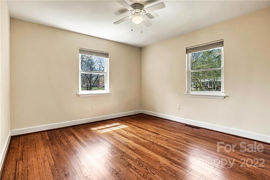 422 Fieldstone Road Mooresville, NC 28115 - Photo 18 of 36 a view of an empty room with wooden floor and a window