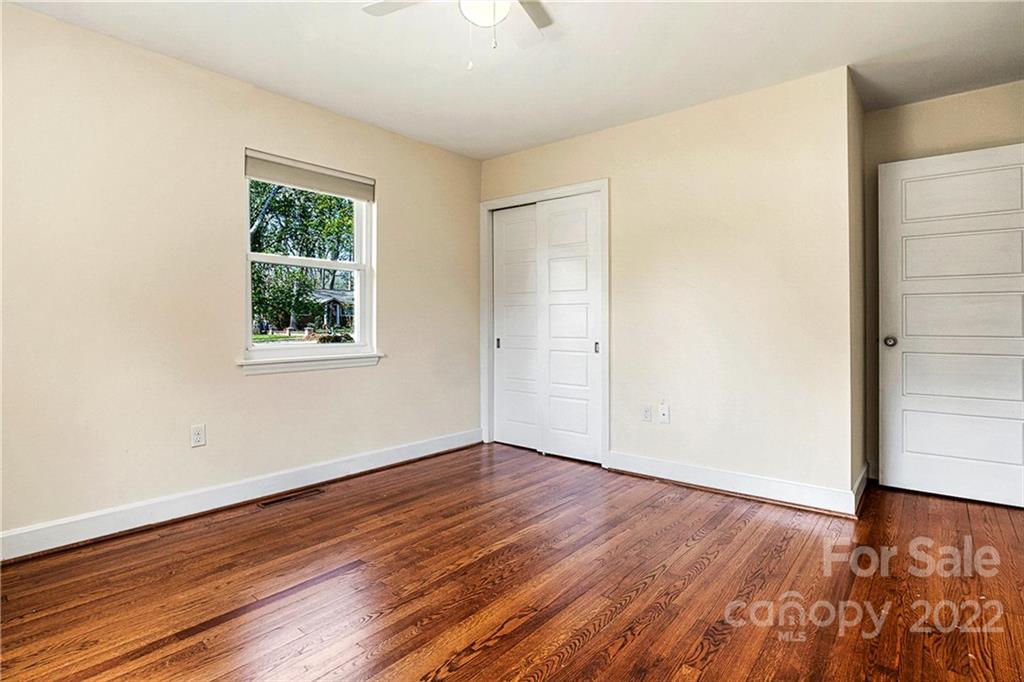 422 Fieldstone Road Mooresville, NC 28115 - Photo 19 of 36 an empty room with wooden floor and windows