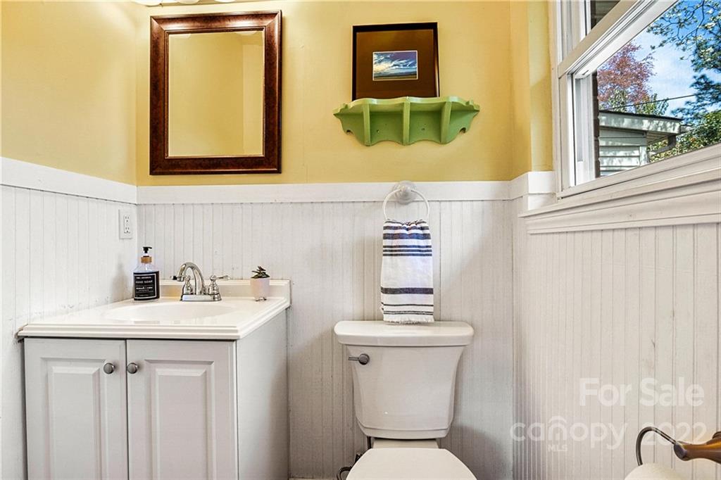 422 Fieldstone Road Mooresville, NC 28115 - Photo 22 of 36 a bathroom with a toilet sink and mirror