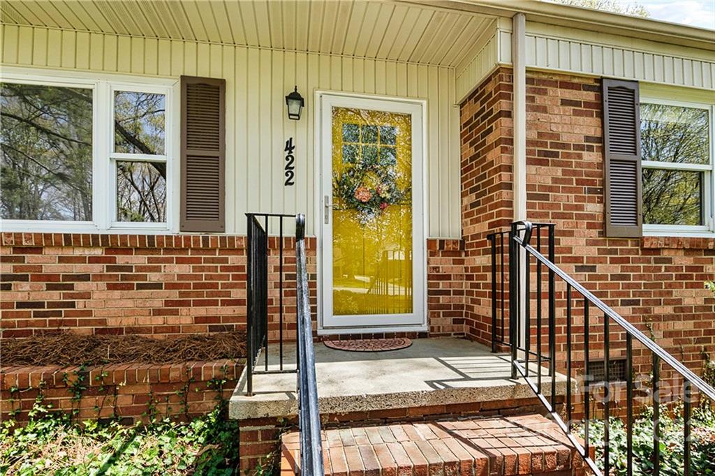 422 Fieldstone Road Mooresville, NC 28115 - Photo 6 of 36 a view of a brick house with many windows