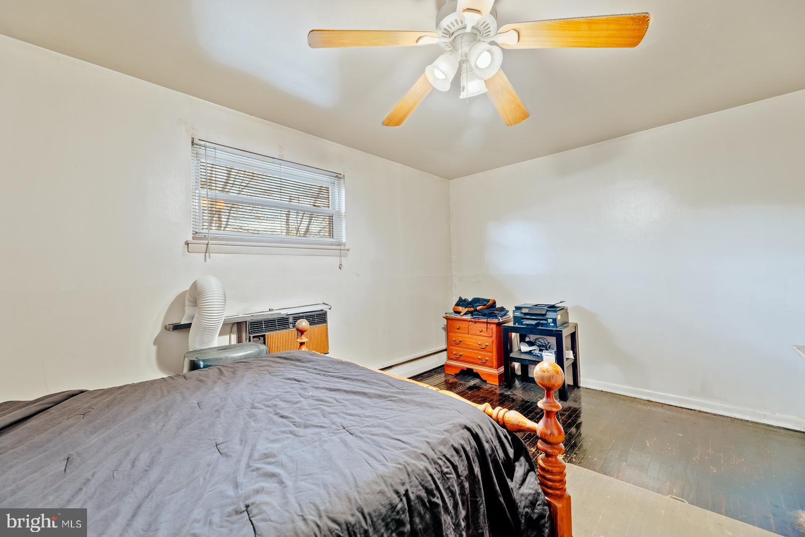 4311 Pearson Avenue Philadelphia, PA 19114 - Photo 16 of 41 a bedroom with a bed and a chandelier
