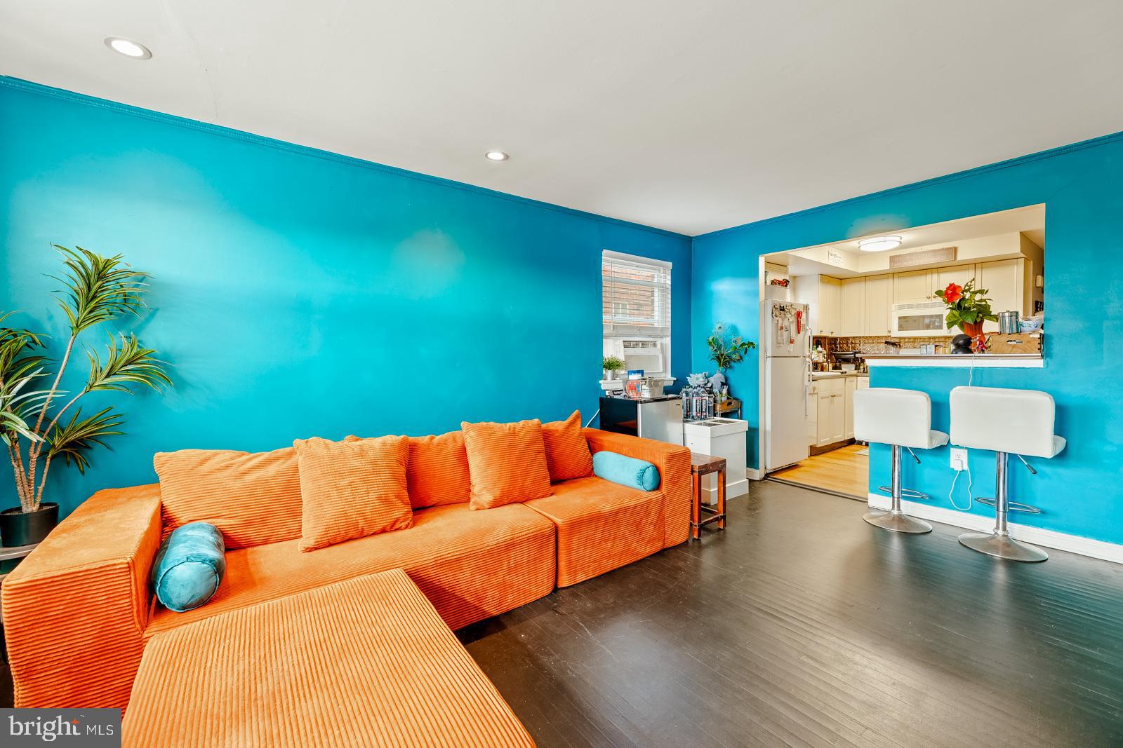 4311 Pearson Avenue Philadelphia, PA 19114 - Photo 18 of 41 a blue room with a couch and a potted plant