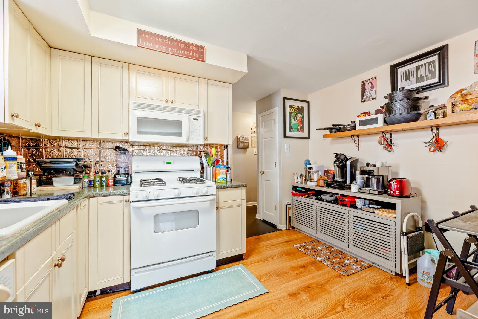 4311 Pearson Avenue Philadelphia, PA 19114 - Photo 22 of 41 a view of a kitchen with sink and wooden floor