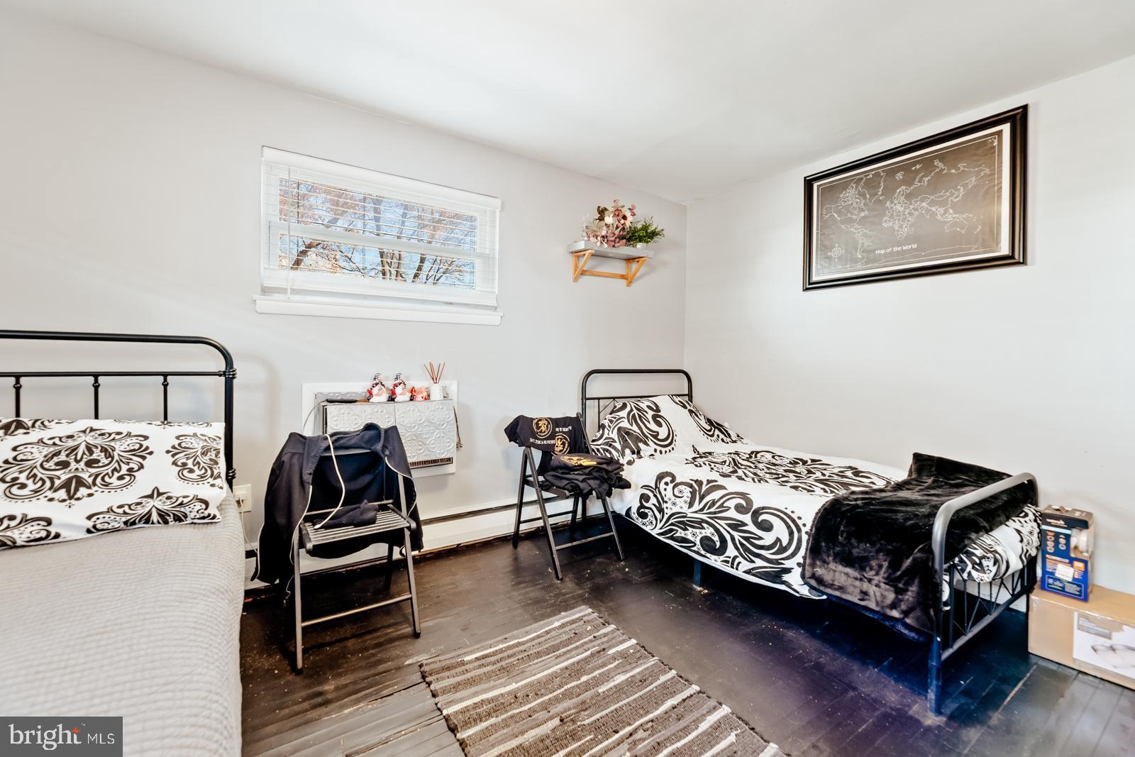 4311 Pearson Avenue Philadelphia, PA 19114 - Photo 25 of 41 a bedroom with bed and a couch