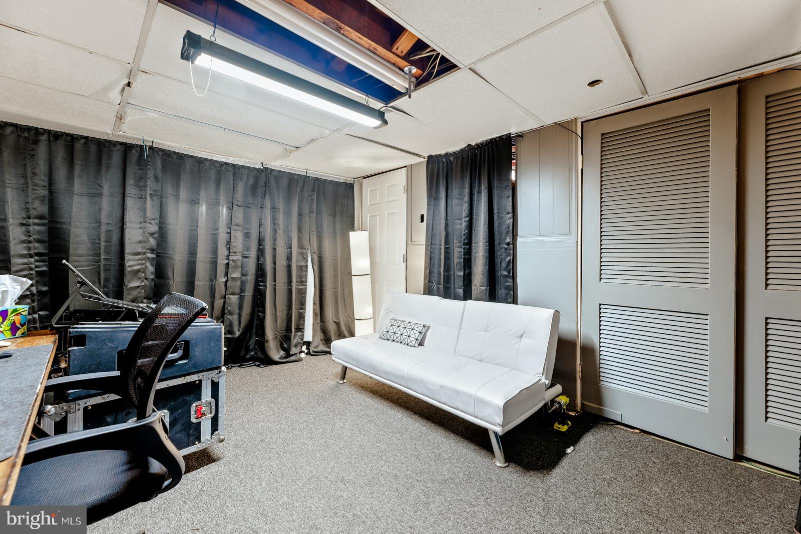 4311 Pearson Avenue Philadelphia, PA 19114 - Photo 32 of 41 a living room with furniture and a window