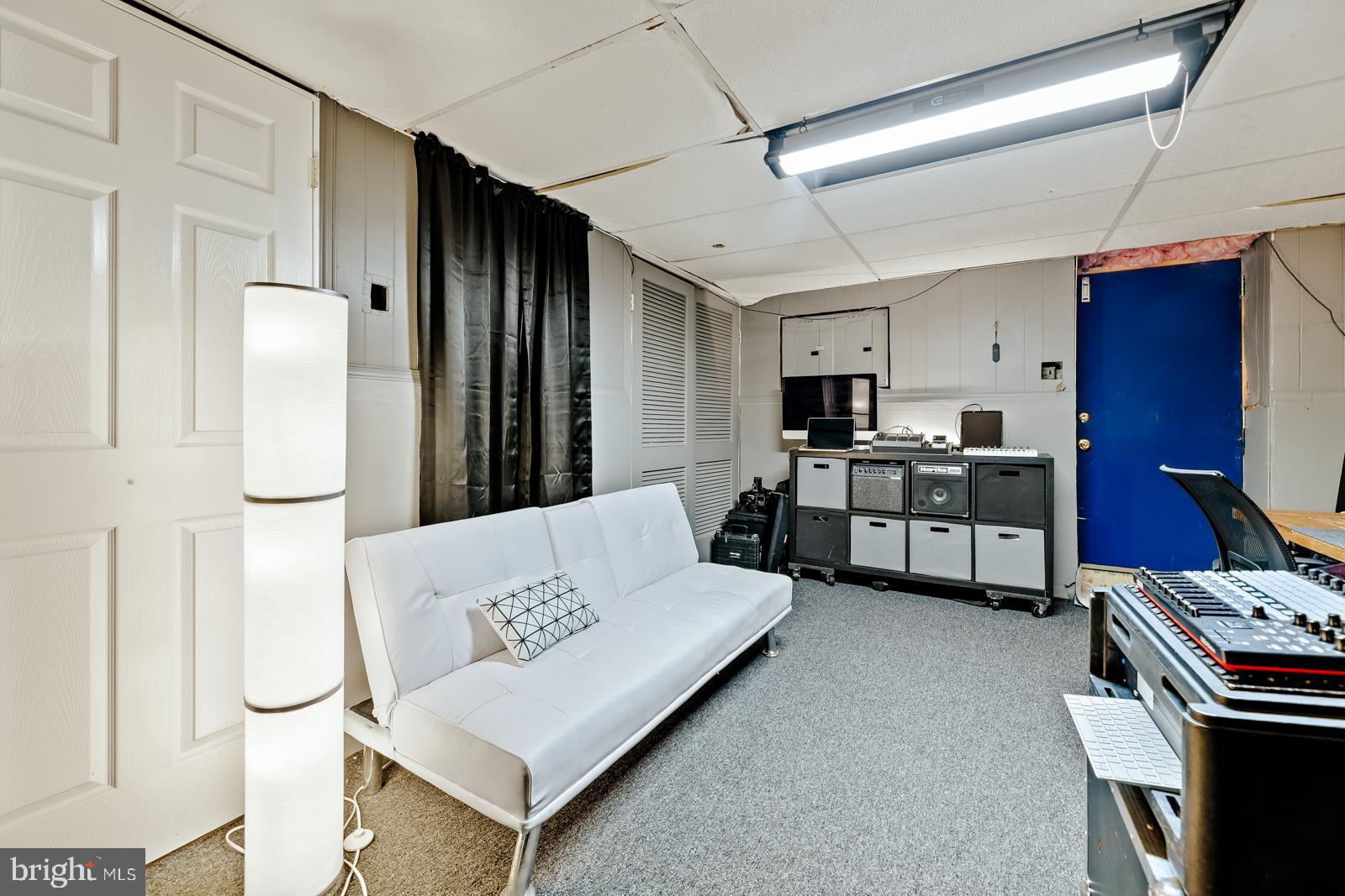 4311 Pearson Avenue Philadelphia, PA 19114 - Photo 33 of 41 a living room with stainless steel appliances furniture a rug and a kitchen view