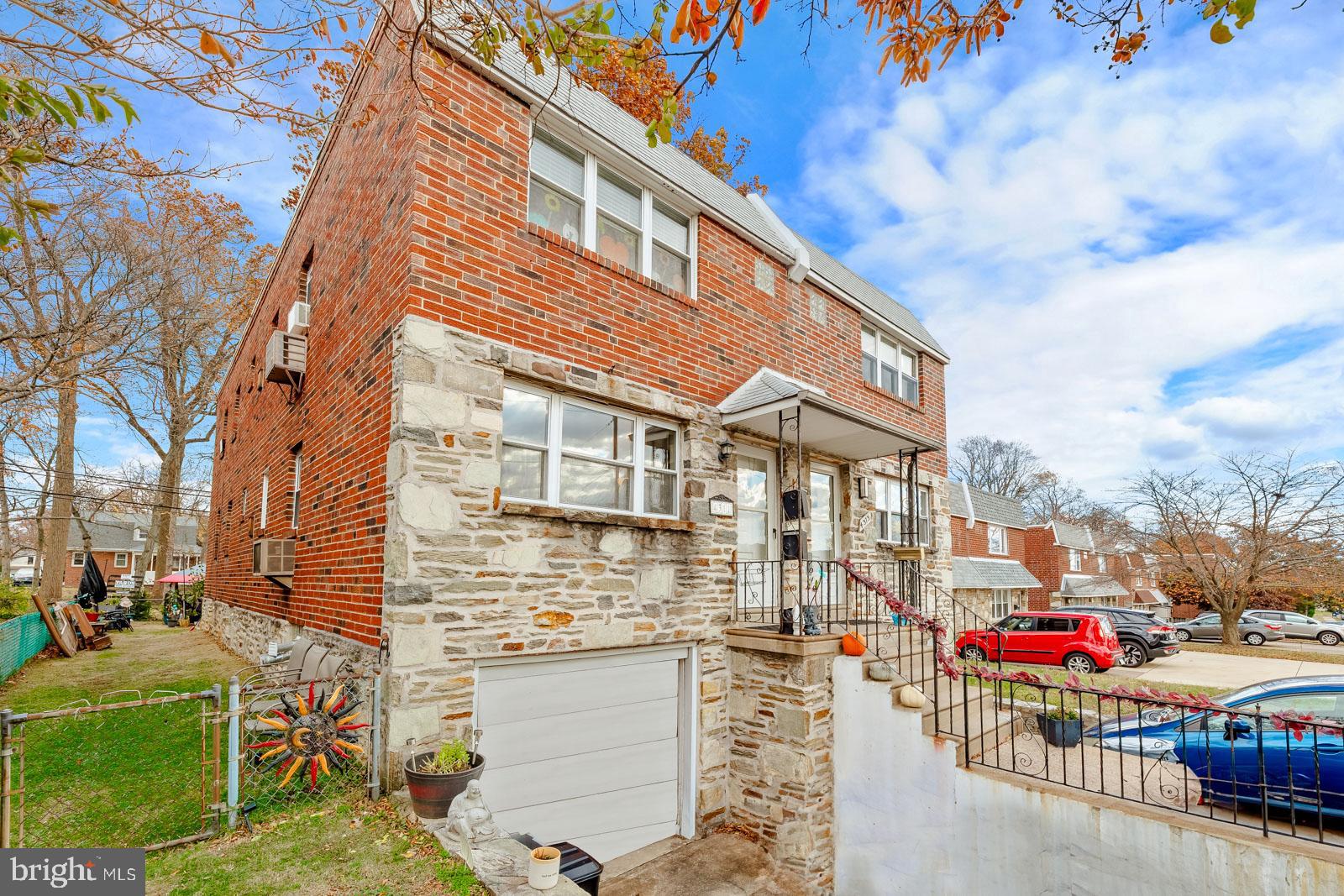 4311 Pearson Avenue Philadelphia, PA 19114 - Photo 37 of 41 a front view of a building with dining table and chairs