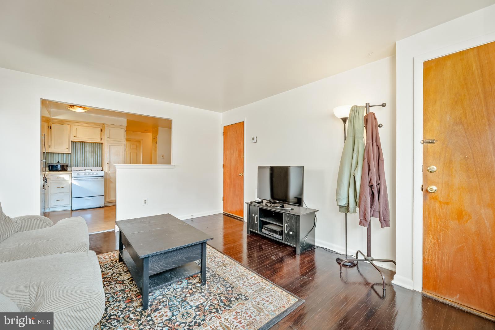 4311 Pearson Avenue Philadelphia, PA 19114 - Photo 5 of 41 a living room with furniture a rug and a flat screen tv