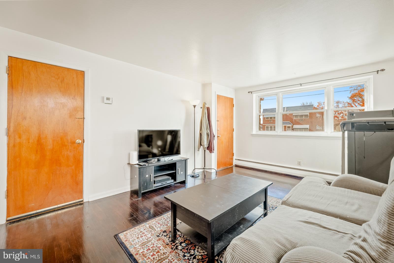 4311 Pearson Avenue Philadelphia, PA 19114 - Photo 7 of 41 a living room with furniture and a flat screen tv