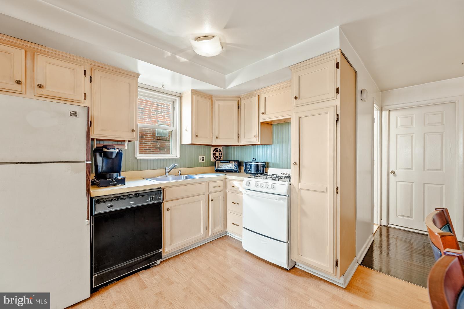 4311 Pearson Avenue Philadelphia, PA 19114 - Photo 9 of 41 a kitchen with white cabinets and white appliances