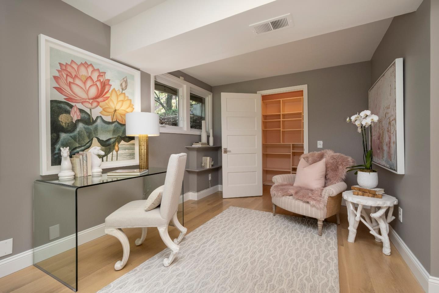775 Bowhill Road Hillsborough, CA 94010 - Photo 15 of 28 a living room with furniture and a painting on the wall