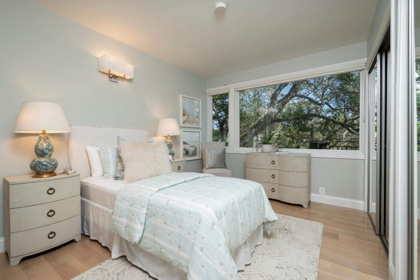 775 Bowhill Road Hillsborough, CA 94010 - Photo 19 of 28 a bedroom with a large bed and a window