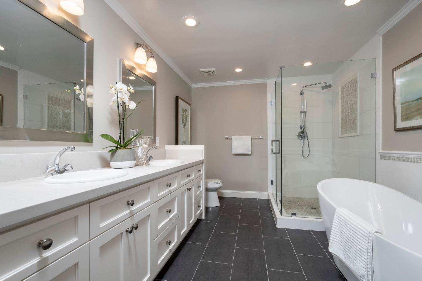 775 Bowhill Road Hillsborough, CA 94010 - Photo 21 of 28 a spacious bathroom with a double vanity sink a large mirror and a shower