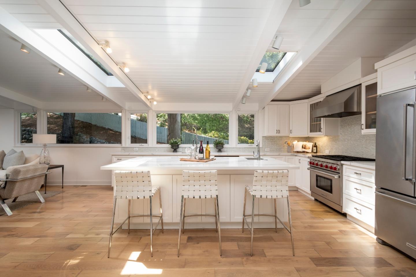 775 Bowhill Road Hillsborough, CA 94010 - Photo 3 of 28 a large kitchen with a table and chairs
