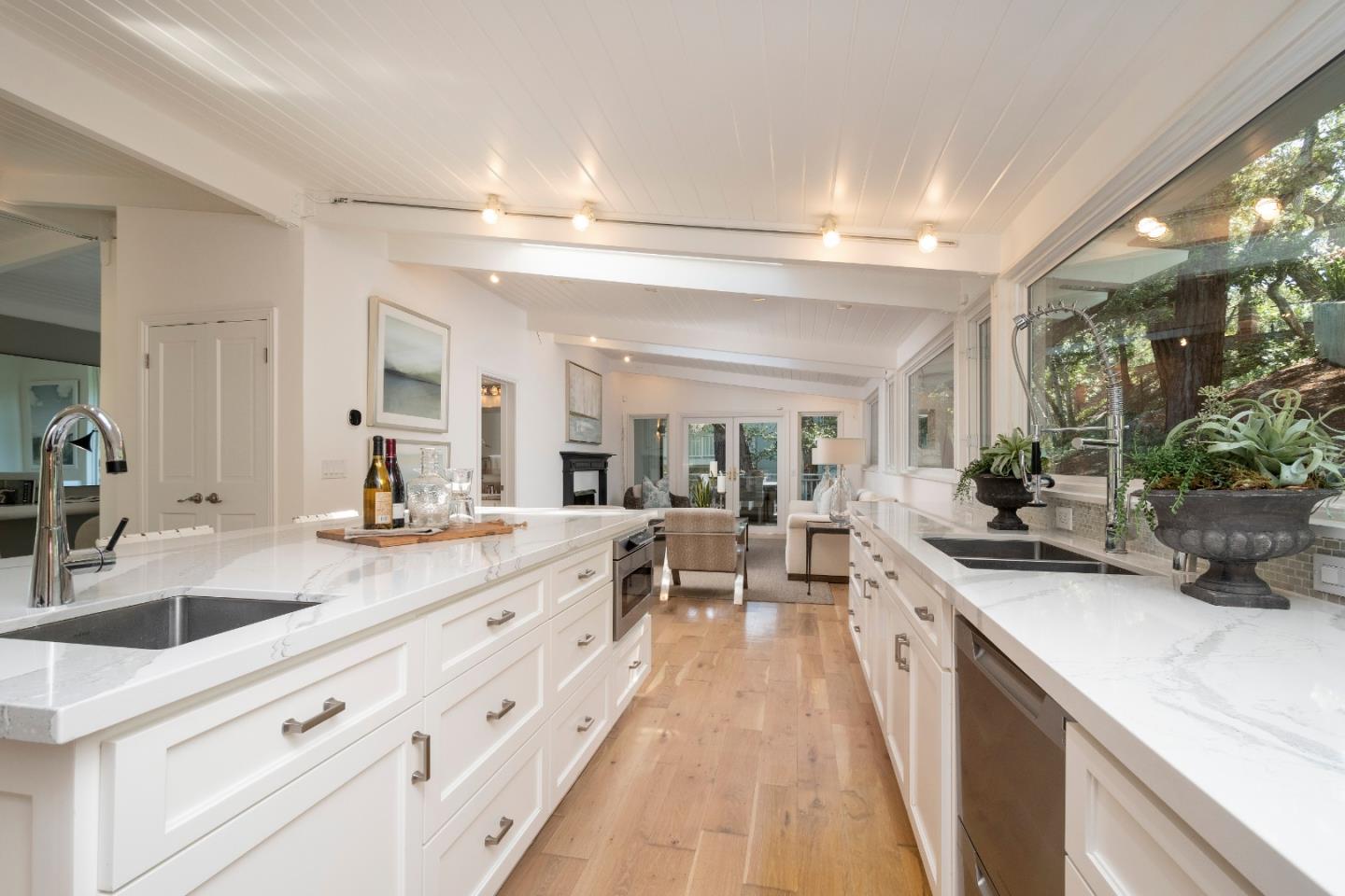 775 Bowhill Road Hillsborough, CA 94010 - Photo 4 of 28 a large white kitchen with cabinets a sink and a stove