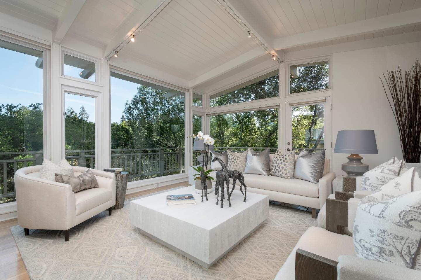 775 Bowhill Road Hillsborough, CA 94010 - Photo 10 of 28 a living room with furniture and a large window