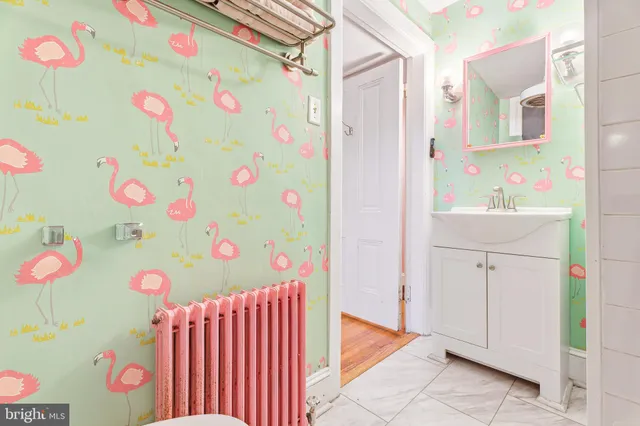 a view of a livingroom with furniture and a window