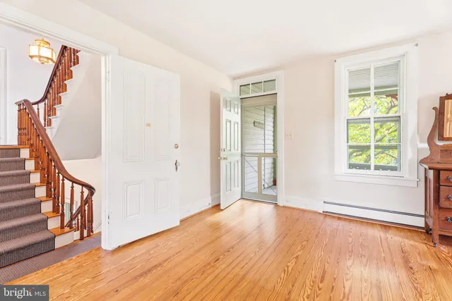 a view of staircase with wooden floor and a potted plant