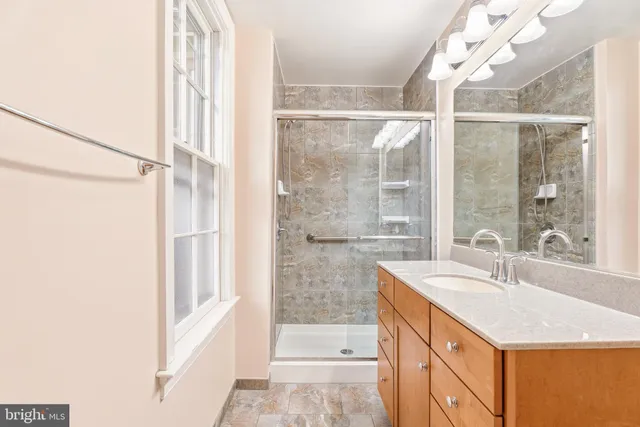 a white toilet sitting next to a bathroom sink