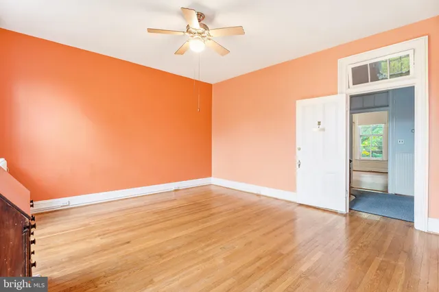 a bathroom with a tub a sink and a mirror