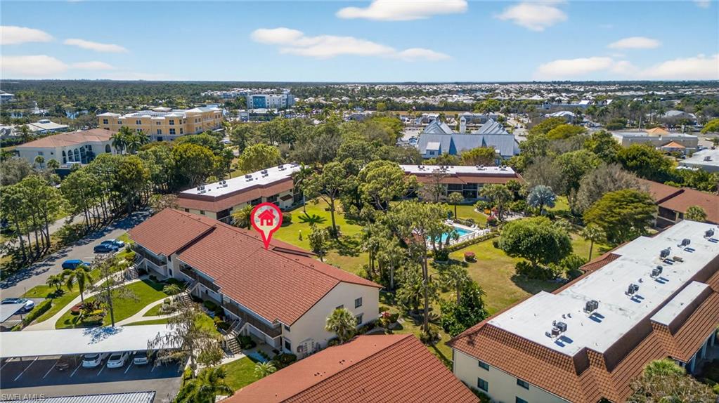 4973 Pepper Circle, Unit F105 Naples, FL 34113 - Photo 17 of 21 an aerial view of a house with a lake view