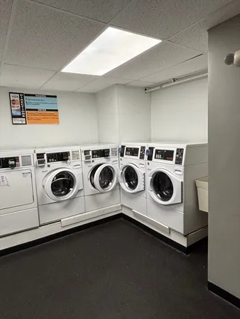 a white stove top oven sitting inside of a kitchen