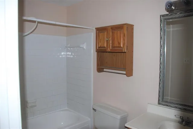 a swimming pool with outdoor seating and yard