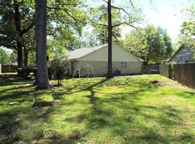 a backyard of a house with lots of green space