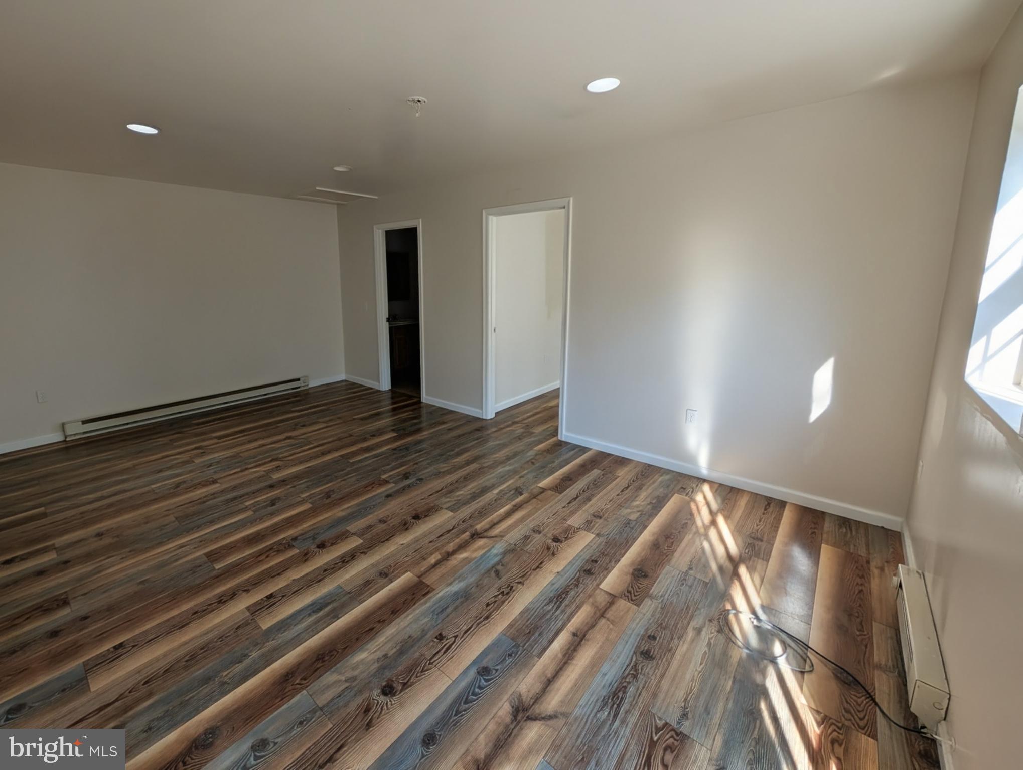 383 Nottingham Road Quarryville, PA 17566 - Photo 3 of 10 a view of an empty room with wooden floor
