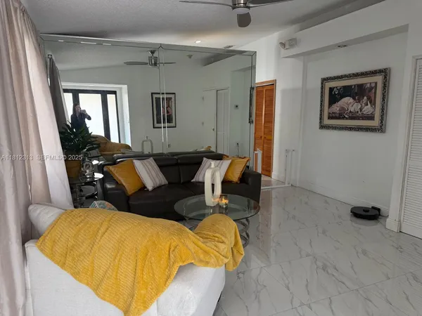 a blue and white bed sitting in a room next to a window