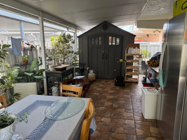 a front view of a house with outdoor seating