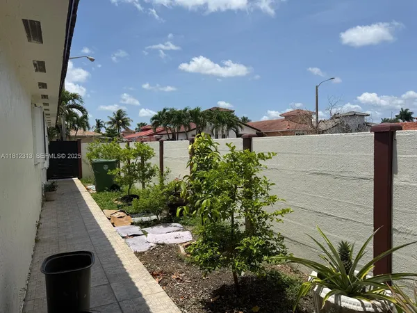 a view of a balcony with plants