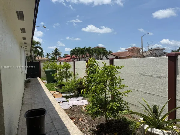 a view of a balcony with plants