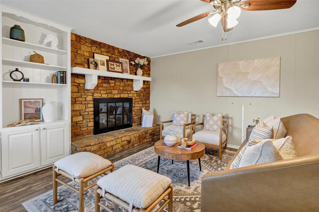 1009 Russell Road Everman, TX 76140 - Photo 2 of 20 a living room with furniture and a fireplace