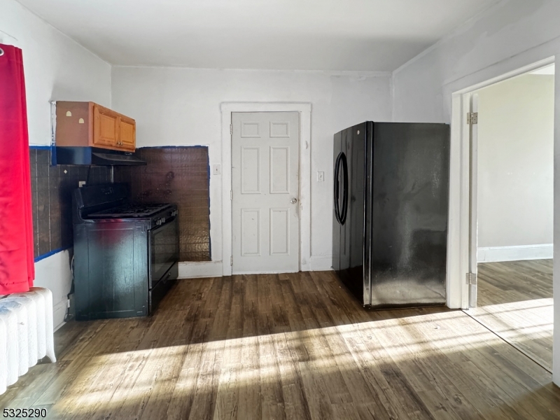 62 Summit Avenue, Unit B Phillipsburg, NJ 08865 - Photo 4 of 9 a kitchen with a refrigerator and cabinets