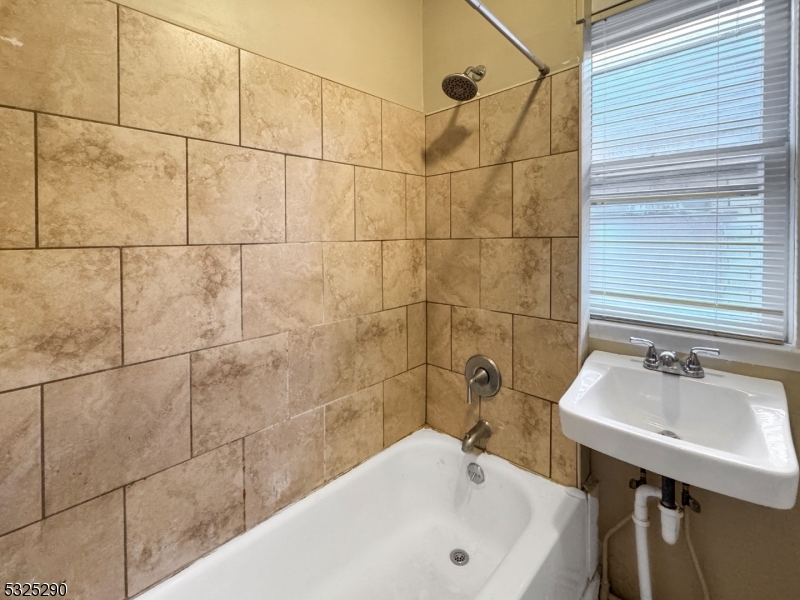 62 Summit Avenue, Unit B Phillipsburg, NJ 08865 - Photo 8 of 9 a bathroom with a sink and shower