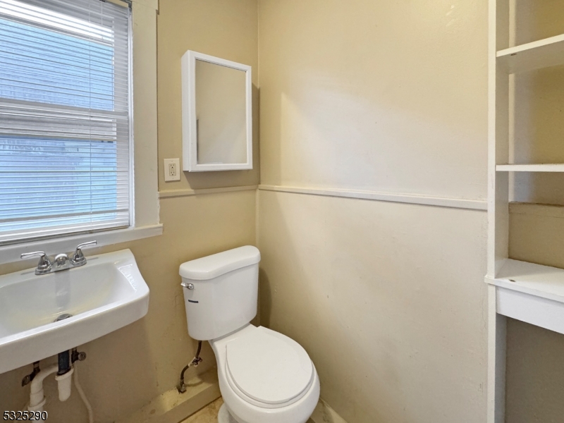 62 Summit Avenue, Unit B Phillipsburg, NJ 08865 - Photo 9 of 9 a white toilet sitting next to a bathroom sink