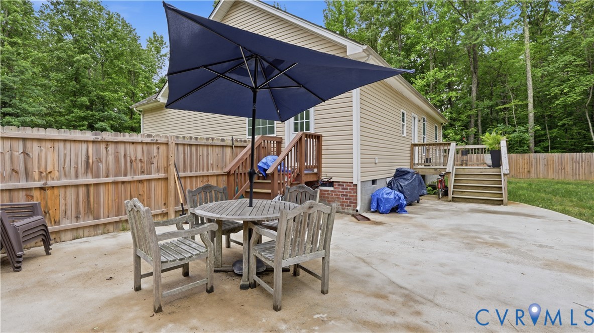 2406 Emanuel Church Road Powhatan, VA 23139 - Photo 31 of 48 Concrete patio featuring a privacy fence, exterior