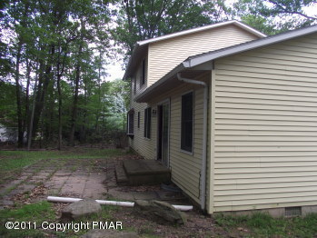 30 Holly Forest Road Mount Pocono, PA 18344 - Photo 2 of 12 a view of a small house with a yard
