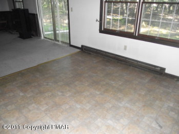 30 Holly Forest Road Mount Pocono, PA 18344 - Photo 5 of 12 an empty room with windows