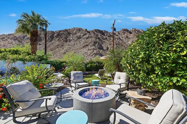 a view of a chairs and table in patio