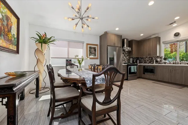 a kitchen with stainless steel appliances a sink and a stove